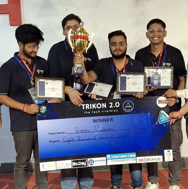 Team holding the Trikon 2.0 winner trophy