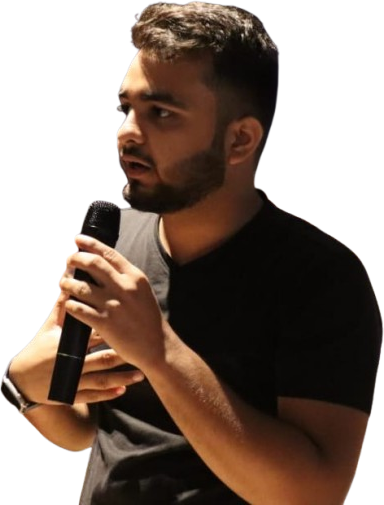 Harsh Raj Shukla speaking into a microphone